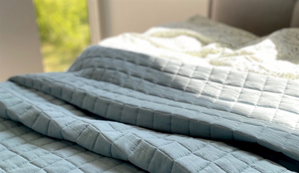 Indret dit soveværelse med et sengetæppe